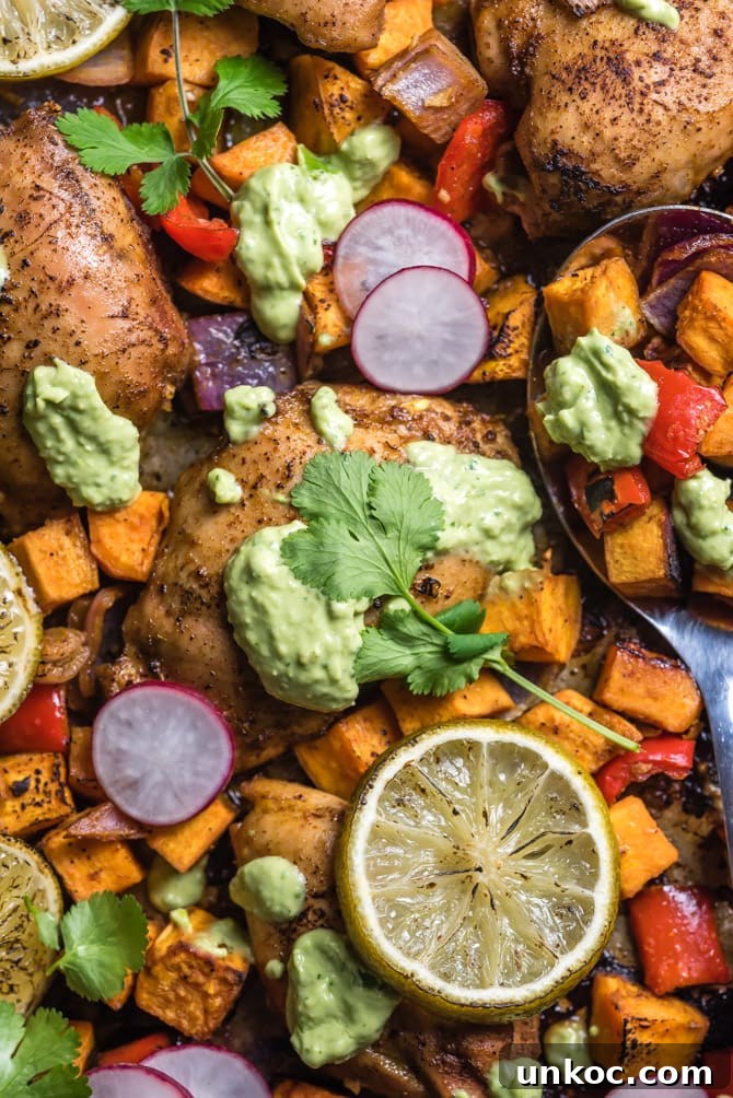 Chili-lime chicken thighs and sweet potatoes prepared on a sheet pan.
