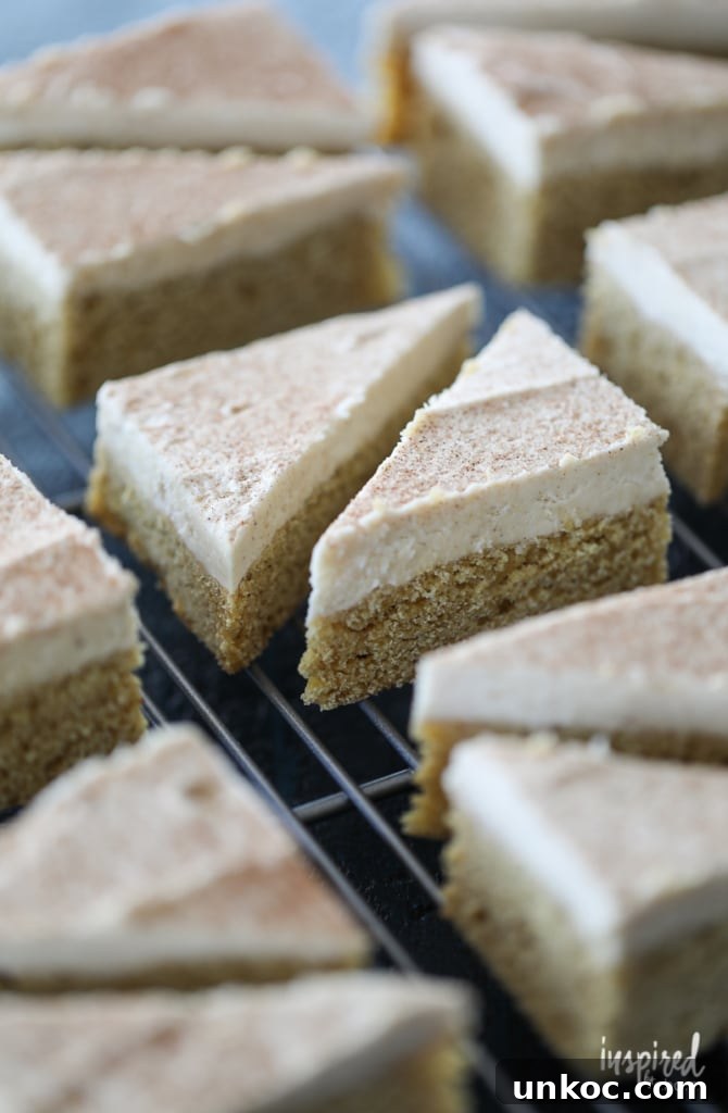 Frosted pumpkin cookie bars with maple buttercream frosting.
