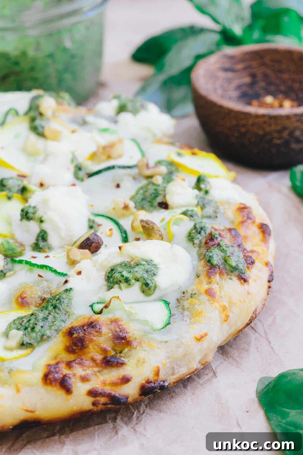 Skillet Zucchini Pesto Pizza is a burst of summer ingredients with each bite.