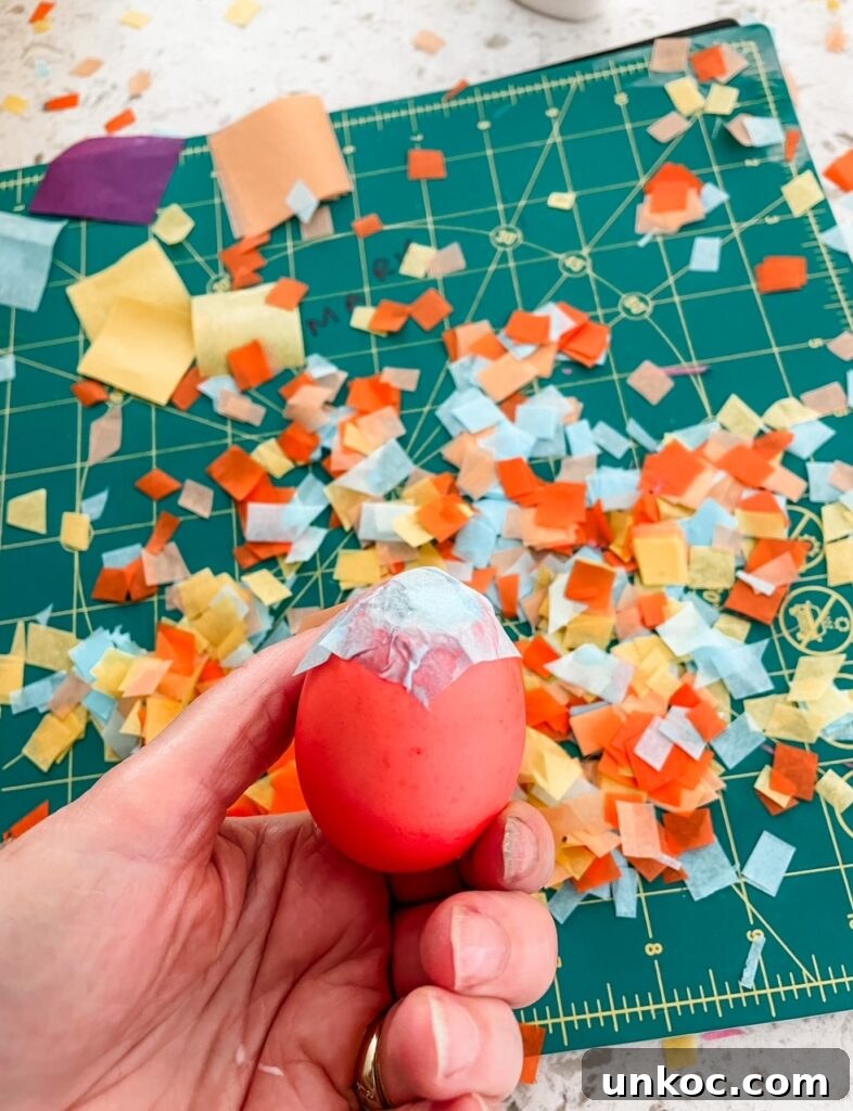 DIY Confetti Easter Eggs for Easter Crafts 3 One of the DIY Confetti Easter Eggs being held up