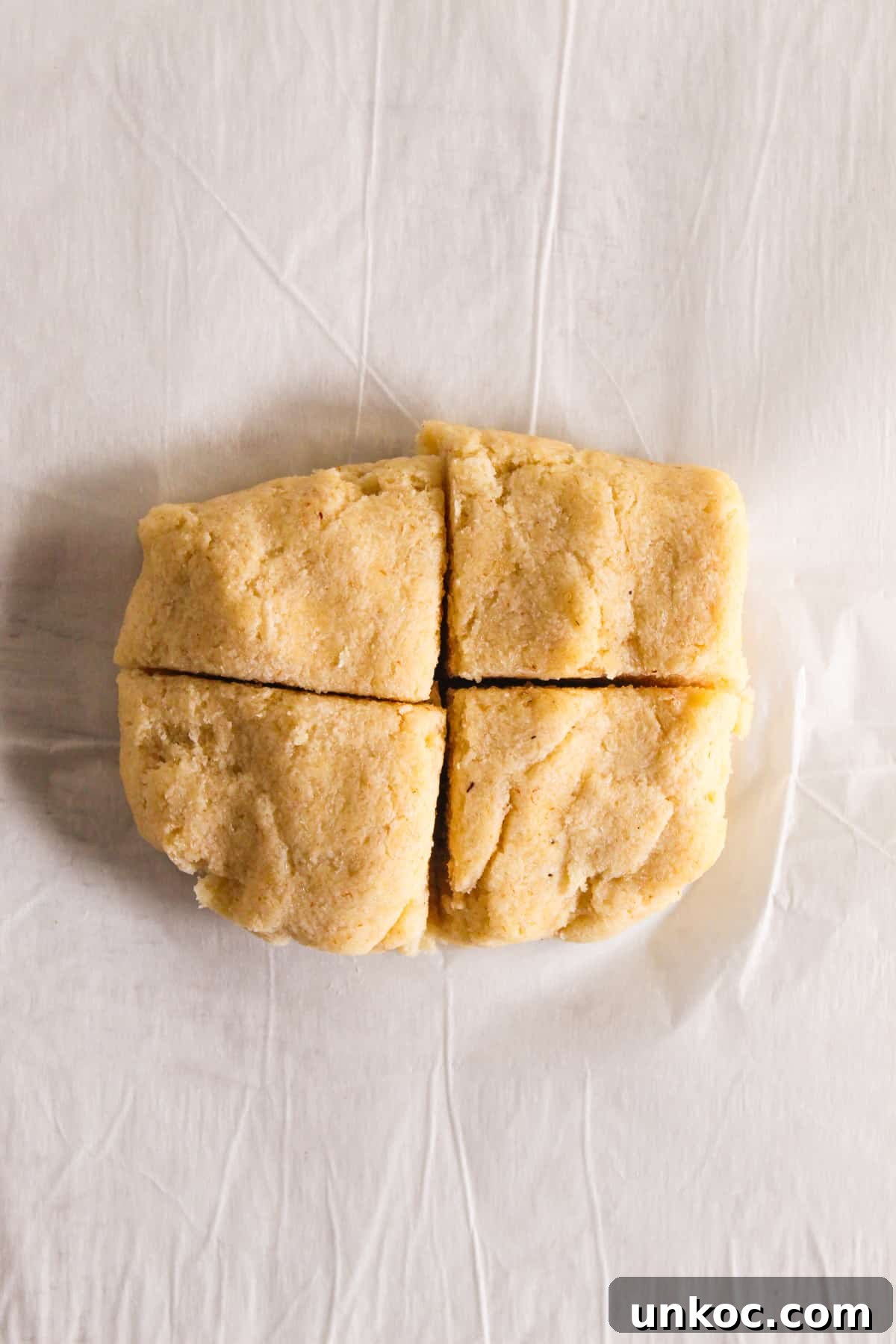Soft Keto Almond Flour Tortillas That Fold Without Cracking 10 Almond Flour Tortilla Dough Divided Into Four on the Parchment Paper