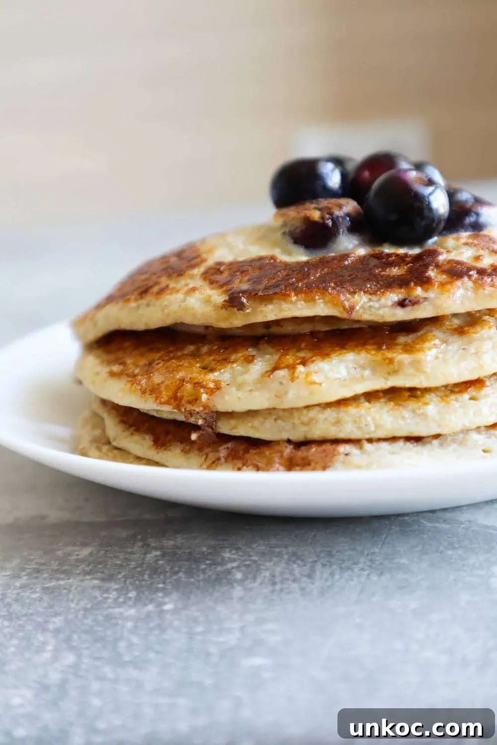 Flourless Blueberry Oatmeal Pancakes No Banana 6 Healthy flourless blueberry oatmeal pancakes served as a quick breakfast or snack.