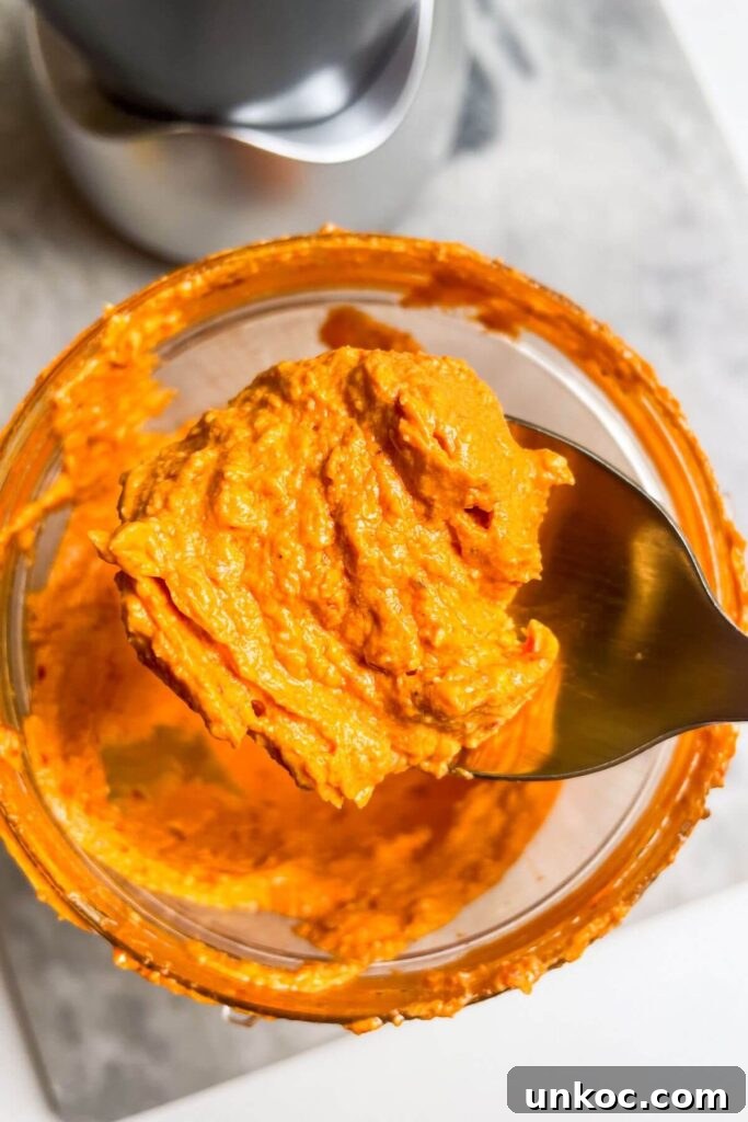 Spicy Harissa Whipped Feta Dip 6 Spicy feta dip on a gold spoon.
