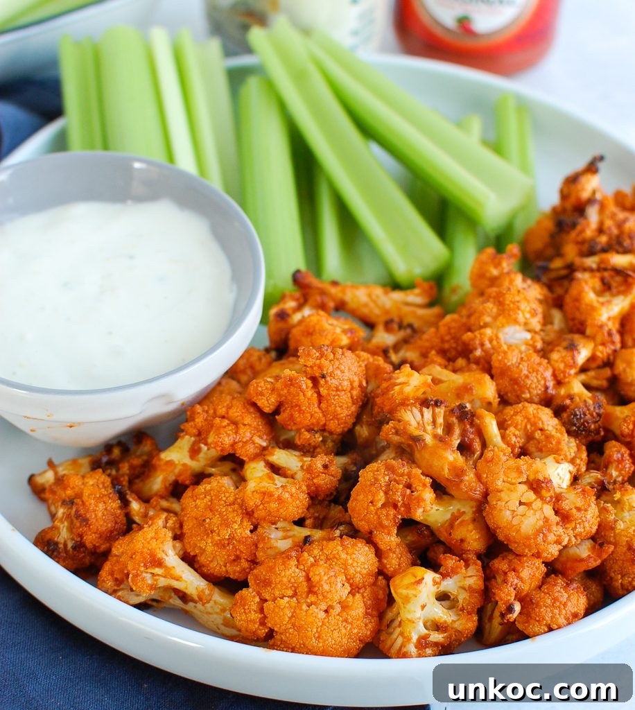 Crispy Air Fryer Buffalo Cauliflower Bites 2 Air Fryer Buffalo Cauliflower on white plate