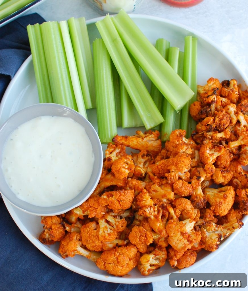 Crispy Air Fryer Buffalo Cauliflower Bites 4 Air Fryer Buffalo Cauliflower on white plate