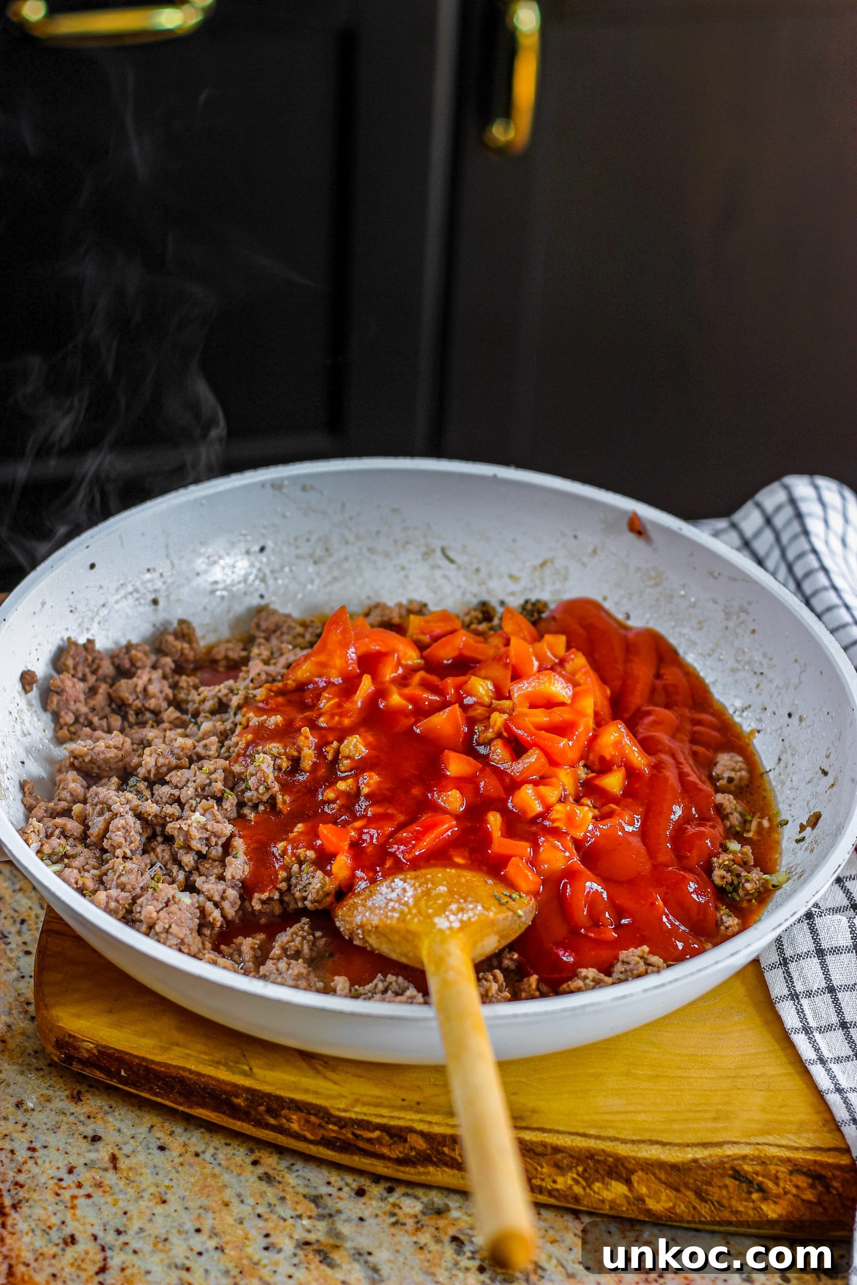 Poor Mans Husband Casserole with Ground Beef 10 Tomato sauce and ground beef mixture for casserole