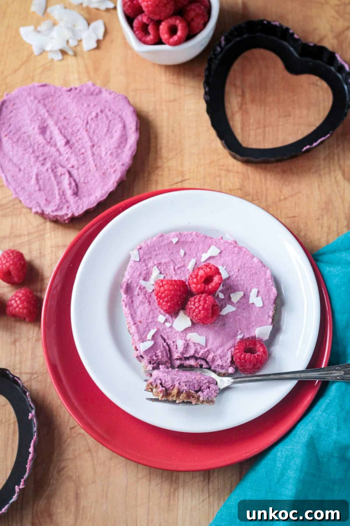 Vegan Raw Raspberry Cheesecake Recipe 7 Bite of raspberry vegan cheesecake on a fork.