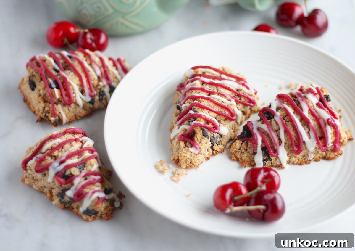 Paleo Frosted Cherry Scones (AIP) - dried cherry scones with a touch of optional almond extract create a delicious treat that is heavenly with tea or coffee! | fedandfulfilled.com
