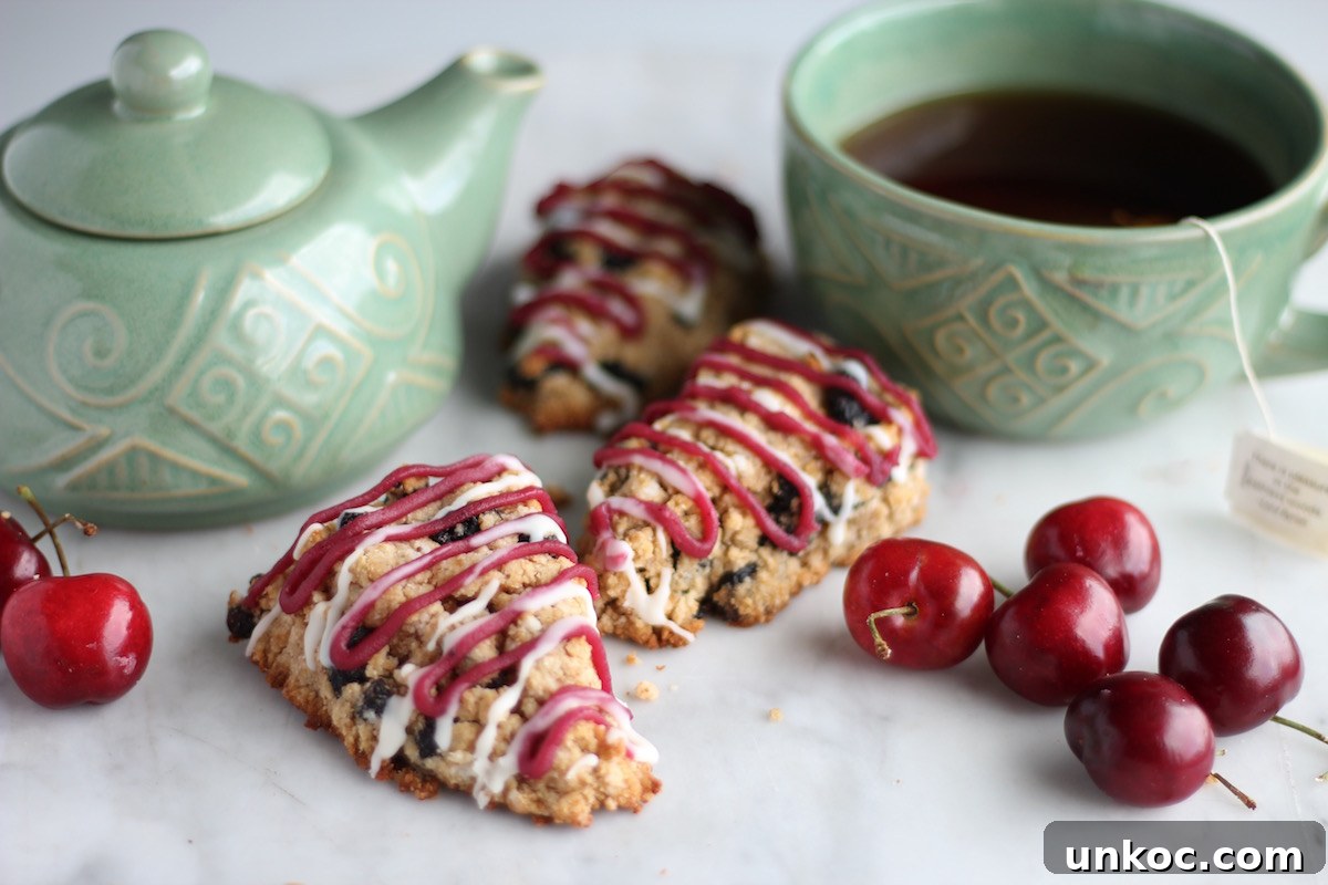Paleo Frosted Cherry Scones (AIP) - soft, tender scones are filled with dried cherries and topped with a cherry coconut butter glaze! | fedandfulfilled.com