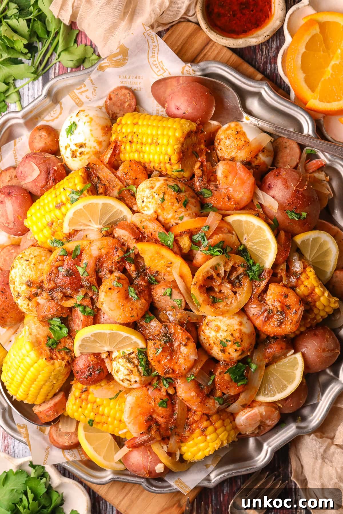 Cajun Shrimp Boil with Corn and Potatoes 2 cajun shrimp boil on a large platter.
