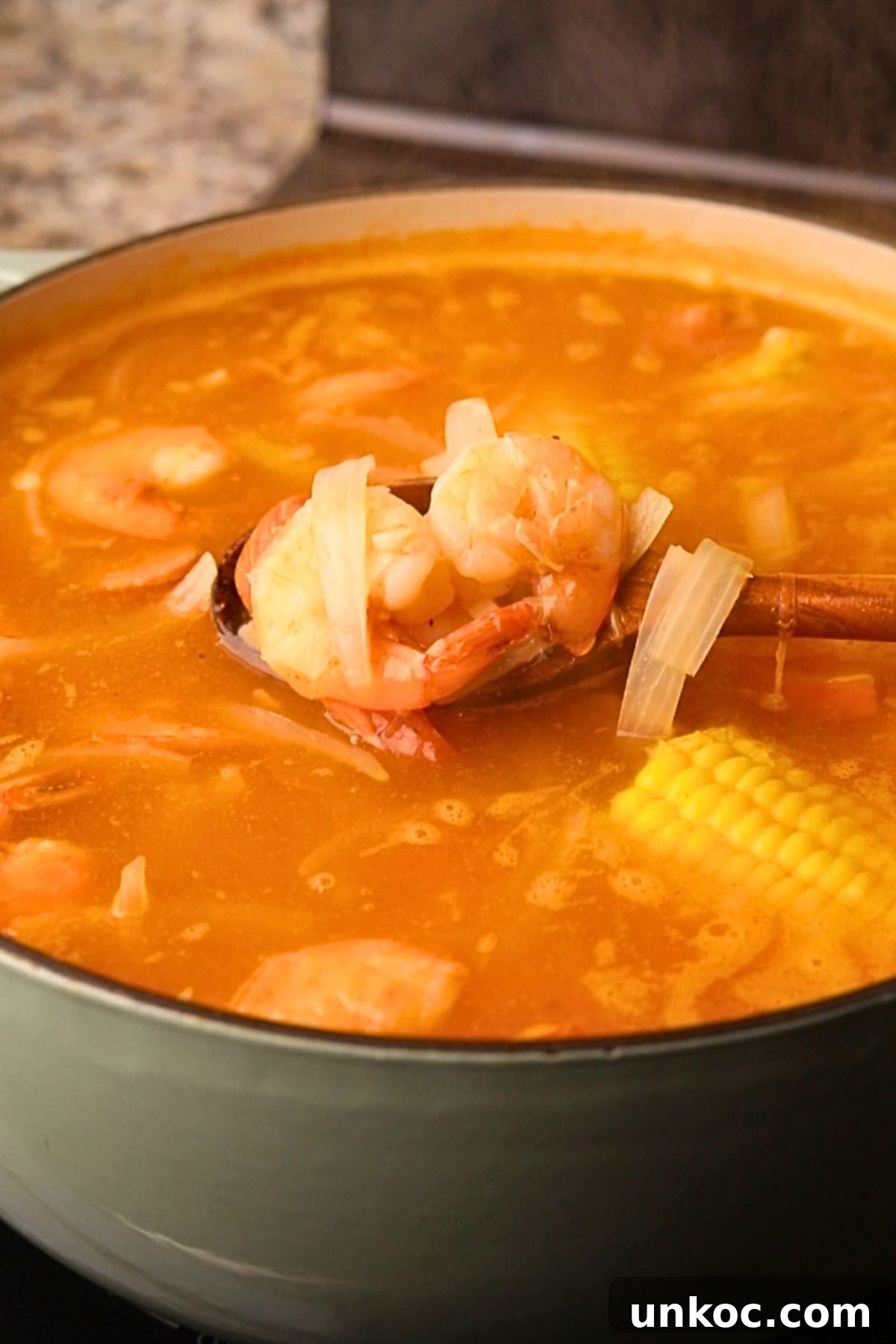 Cajun Shrimp Boil with Corn and Potatoes 5 Shrimp boil cooking in a pot on a stovetop.