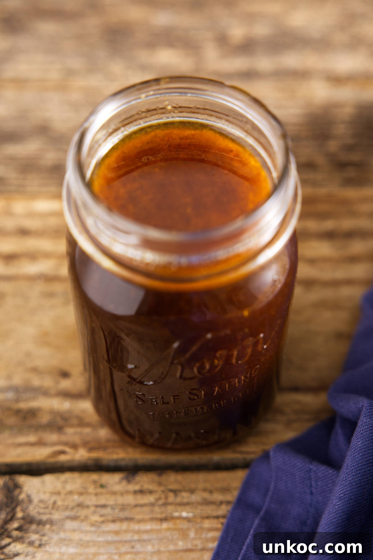 Glass Mason jar filled with pork loin marinade.