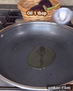 Jaffna Eggplant Chickpea Curry Sri Lankan Brinjal Recipe 12 Oil 1 tbsp in a frying pan for Sri Lankan brinjal curry.
