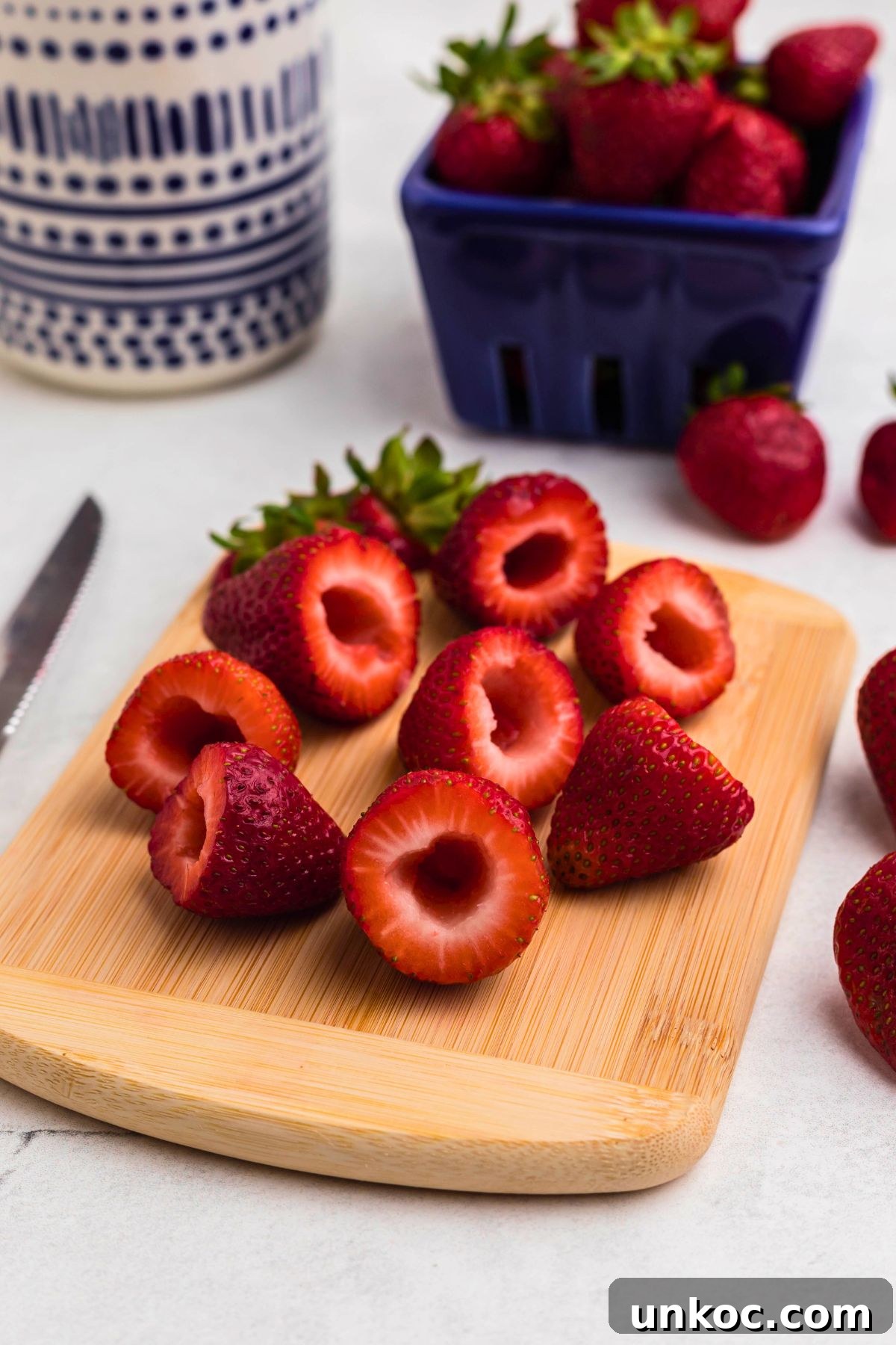 Cheesecake Stuffed Strawberries Recipe 4 Strawberries with tops cut off and the inside scooped out.