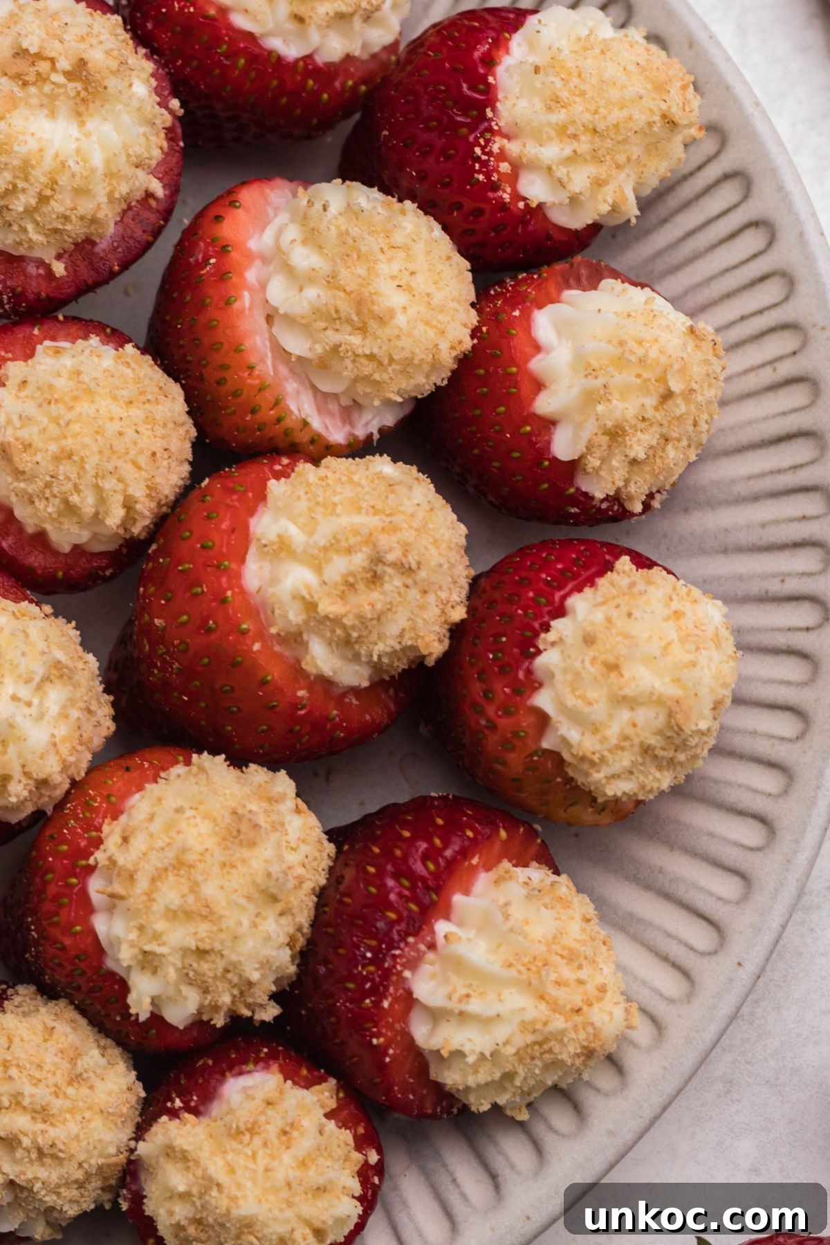 Cheesecake Stuffed Strawberries Recipe 7 Strawberries stuffed with filling and coated with crushed graham crackers.