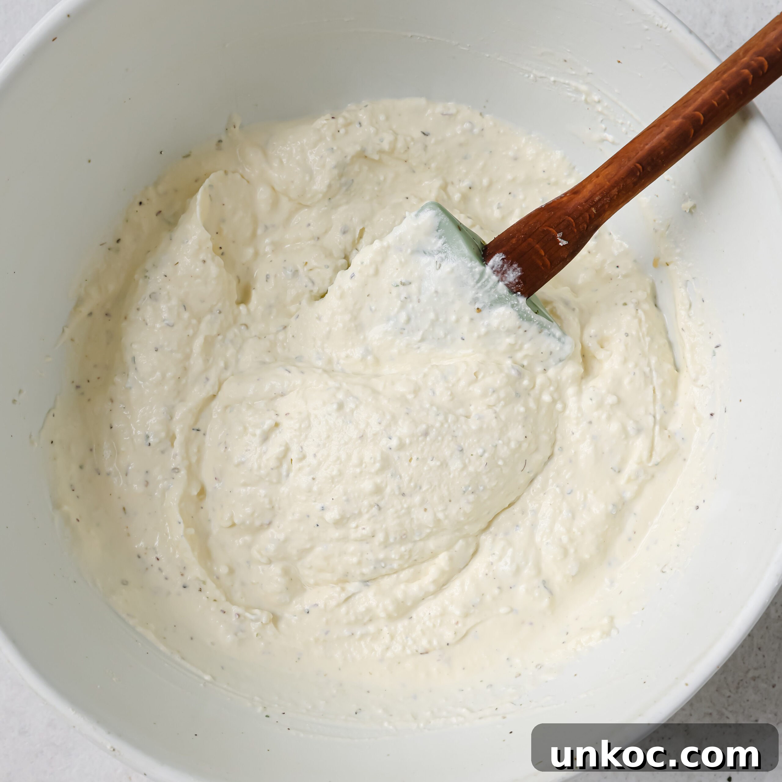 Creamy Cauliflower Au Gratin with Golden Cheese Crust 6 Cream and Parmesan in a bowl.