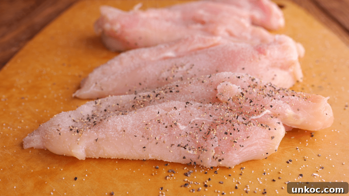 Salt and pepper both sides of the chicken breast.