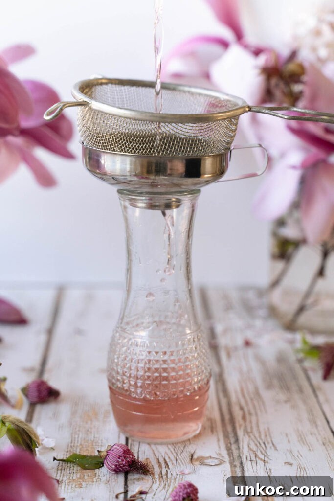 Straining magnolia flower syrup