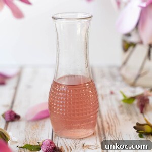 A glass full of magnolia flower syrup