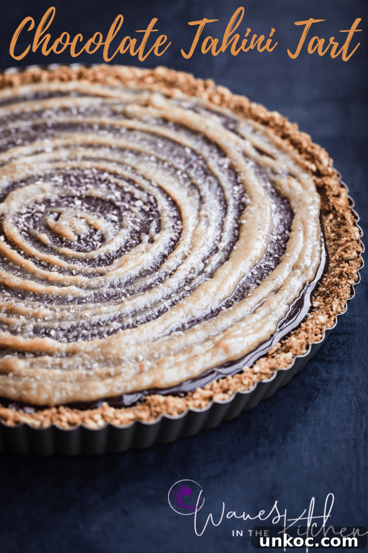 Chocolate Tahini Tart Recipe with Silky Ganache 15 Finished tart with tahini swirl, side angle shot.