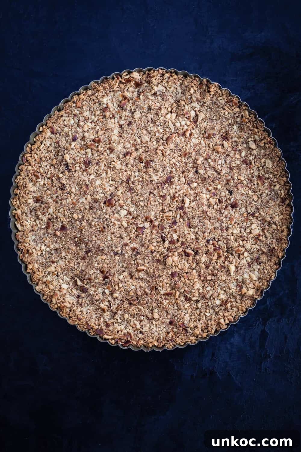 Chocolate Tahini Tart Recipe with Silky Ganache 3 Pretzel crust in tart pan, post oven, overhead shot.