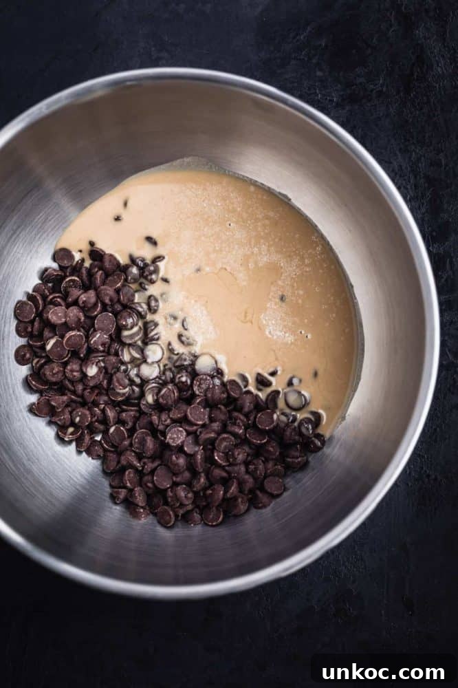 Chocolate Tahini Tart Recipe with Silky Ganache 8 Chocolate chips, salt and tahini in a bowl.