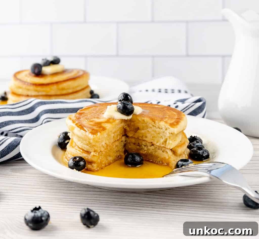 Fluffy Oat Milk Pancakes Recipe 7 Oat Milk Pancakes with a slice missing