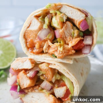 30 Minute Sriracha Chicken Wraps 7 sriracha chicken wraps sliced and stacked on top of each other.