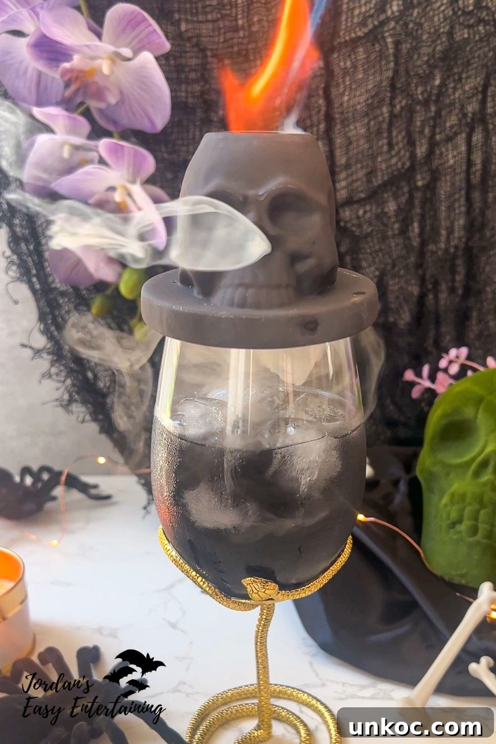 Smoked Blood Orange Margarita for Halloween 4 a skull cocktail smoker in action on top of a margarita Halloween cocktail